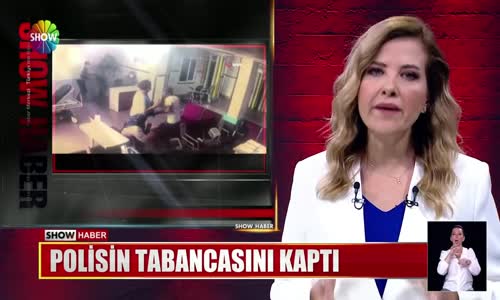 Polisin tabancasını kaptı